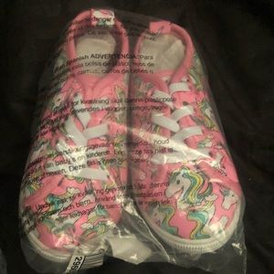 Young girl unicorn shoes